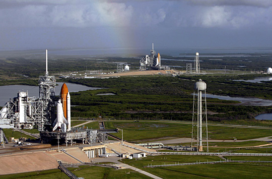 Atlantis and Endeavour on launch pads.