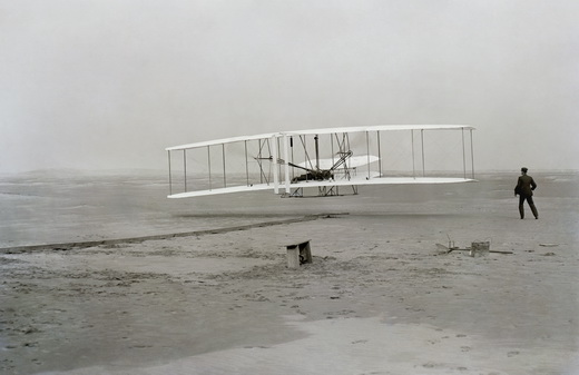 Wright brothers first powered, controlled, and sustained flight, captured on film.
