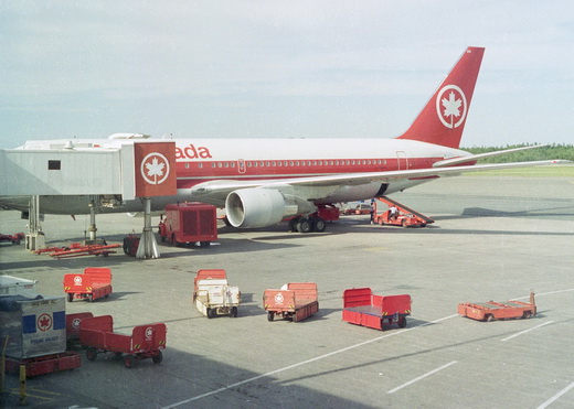 An Air Canada jet parked at the gate in 1990