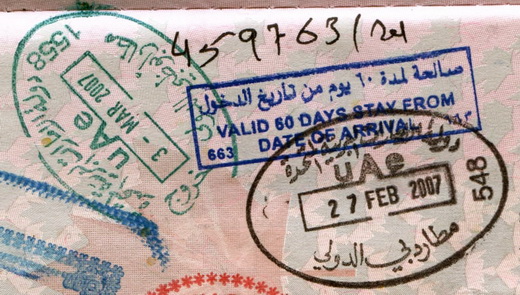 Passport entry stamp from Dubai International Airport (right in black ink). Exit stamp is from Abu Dhabi International Airport.