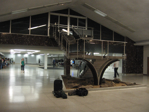 
The interior lobby of the 1962 Birmingham Air Terminal at Birmingham International Airport viewed from the front doors. This terminal served passengers until the current commercial terminal was constructed and now serves various administrative and support functions. The former ticketing area is in the background of the photo.