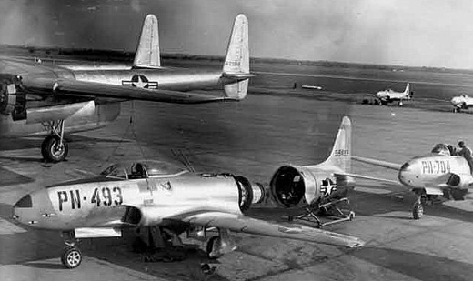 
Lockheed F-80s of the 1st Fighter Group, 1949. F-80C 49-493 undergoing maintenance, and F-80B 45-8704 behind it. 8704 is now on permanent display at the Aerospace Museum of California, located at the former McClellan AFB, near Sacramento.