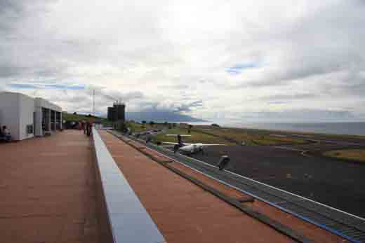 
Scene atop the main terminal building, showing the runway, flight and mountain of Pico in the distance