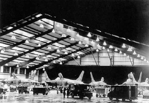 
34th TFW F-105s (JJ Tailcodes) of the 388th TFW undergo nighttime maintenance inside the Big Hangar at Korat in 1968. The large hangar sheltered the aircraft and its ground crews from the intense tropical sunshine and heavy rains during the monsoon seasons.