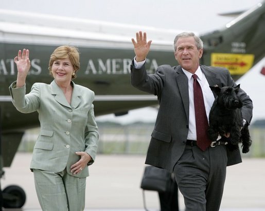 
George W. Bush, Laura Bush, and Barney at the airport
