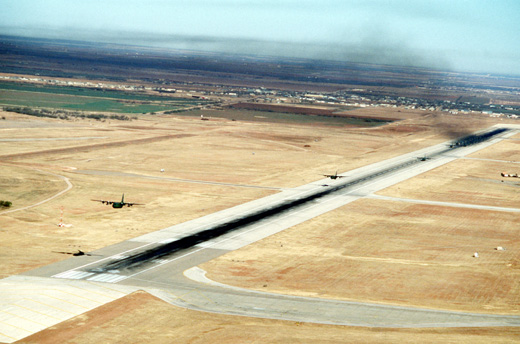 
C-130 aircraft depart from Dyess during a mass airdrop exercise, December 1988.