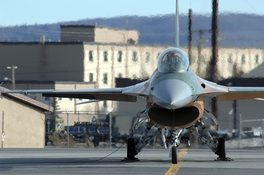 
An F-16 Fighting Falcon aircraft from Nellis Air Force Base's 64th Aggressor Squadron prepares to take off from Eielson Air Force Base.