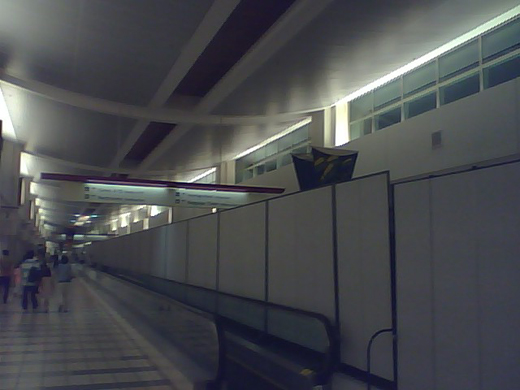 
Semi-permanent barriers separating arrival and departure passengers.