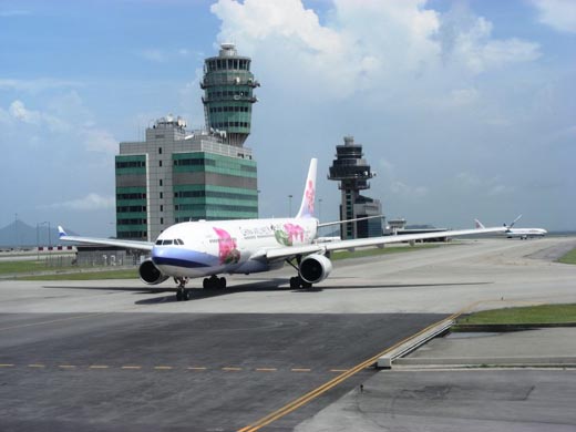 
The airport control tower and a taxiing China Airlines Airbus aircraft