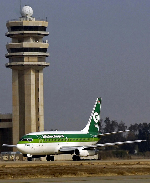 
An Iraqi Airways Boeing 737-200 taxiing in front of Baghdad International Airport control tower. (2008)