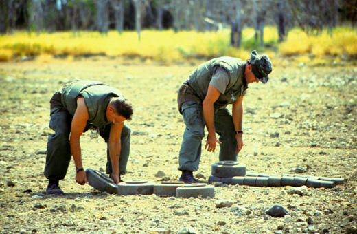 
Minefield maintenance Marines stack mines for disposal, 1997
