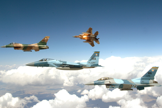 
U.S. Air Force F-15 Eagles and F-16 Fighting Falcons fly above the Nevada Test and Training Ranges on Nellis Air Force Base, Nev., June 5, 2008. The jets are assigned to the 64th and 65th Aggressor squadrons stationed on Nellis Air Force Base.