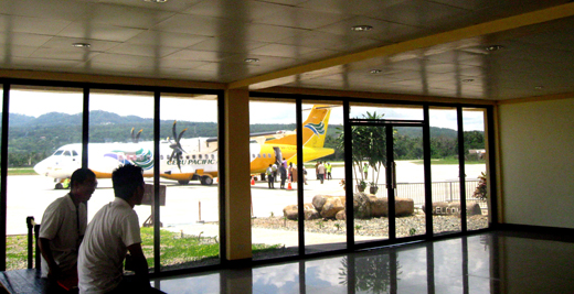 
Passengers boarding a plane, viewed from the Arrival Area