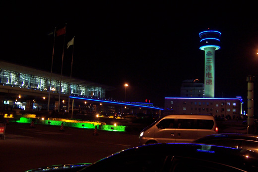 
Like the city itself, colorful neon greets airport visitors at night.