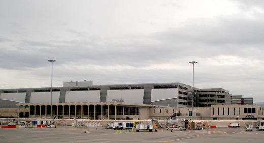 
Terminal C with its dark windows in the foreground, with the new parking structure behind it in early 2010