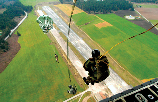 
Explosive Ordnance Disposal Mobile Unit Eleven (EODMU-11) members perform a static jump from the ramp of a C-130 