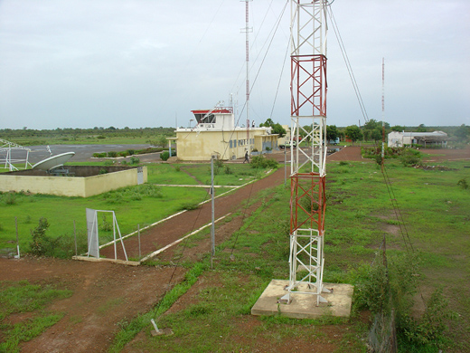 
Airport telecommunication antennas and towers, with terminal in background, 2006.