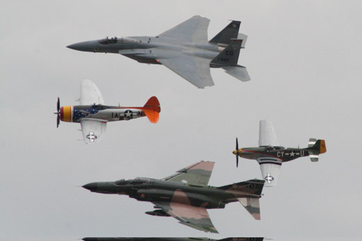 
World War II, Vietnam era and modern US aircraft flying in formation at Wings Over Houston at Ellington Airport