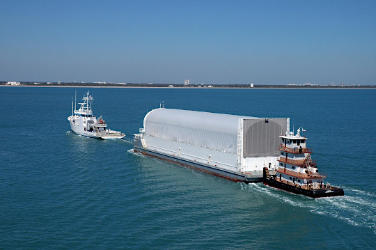 
The barge carrying ET-119 is towed to Port Canaveral.