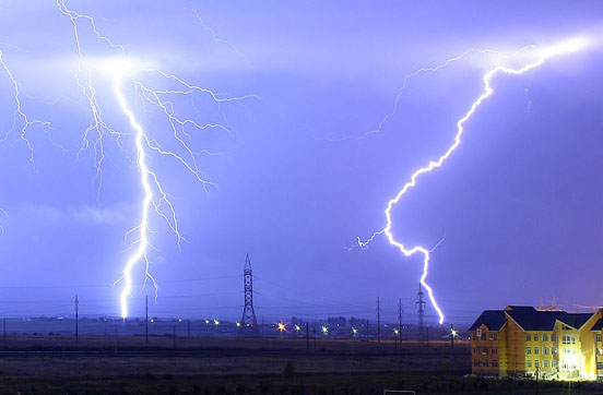 
Lightning is the electric breakdown of air by strong electric fields and is a flow of energy. The electric potential energy in the atmosphere changes into heat, light and sound which are other forms of energy.