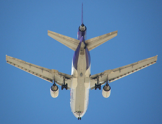 
In 2006, FedEx became the first U.S. carrier to equip its aircraft with an anti-missile defense system. The gray oval Northrop Grumman Guardian pod can be seen on the belly of this FedEx MD-10 between and just aft of the main landing gear.