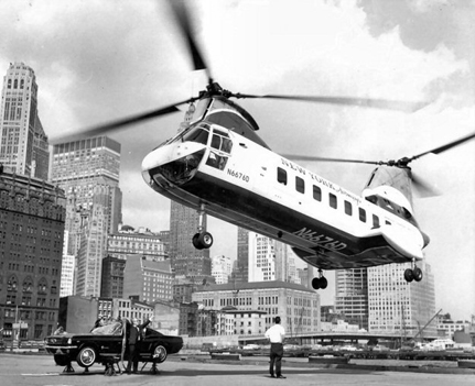 
Taken at the West 30th Street Heliport, New York Airways N6676D is hooked to a Ford Mustang for publicity stunt. The Mustang was flown around Manhattan by the BV 107-II.