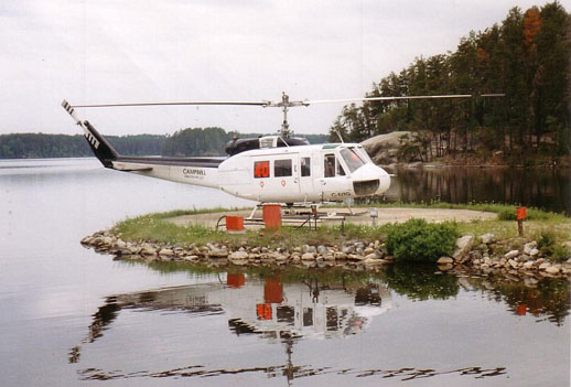 
A Bell 205A-1 on firefighting duty with the Ontario Ministry of Natural Resources at Nym Lake, ON, 1996