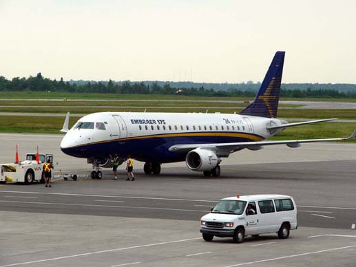 
An E-175, in company demonstrator colours, on the ramp at the Ottawa Macdonald-Cartier International Airport
