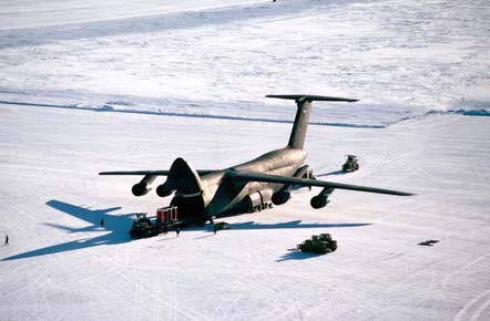 
Personnel unload cargo from a C-5 Galaxy on an ice runway near McMurdo Station, Antarctica in 1989.