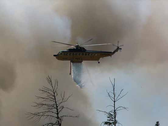 
A Carson Helicopters Fire King drops on the 2007 WSA Lightning Complex fire.