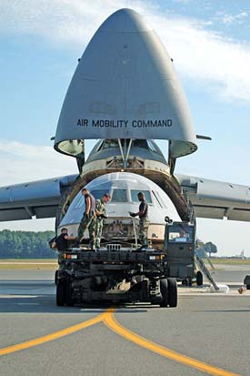 
The flight deck from the C-5B crash at Dover AFB in April 2006 being loaded into a C-5.