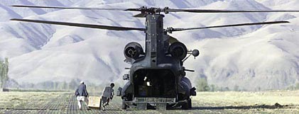 
A U.S. MH-47D stands ready to receive medical supplies in Feyzabad, Afghanistan.