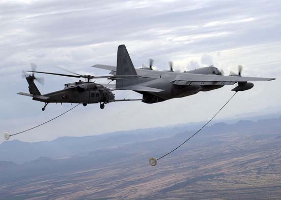 
USAF HC-130P refuels an HH-60G Pavehawk helicopter
