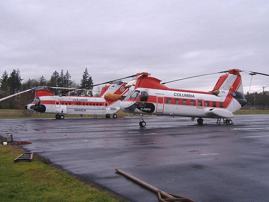 
Columbia Helicopters Inc Boeing Vertol 107 C-FHFW and Boeing 234 N245CH rest on the company pad in Aurora, Oregon