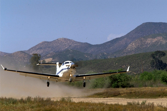
Pilatus PC-12 taking off from short, unimproved airfield