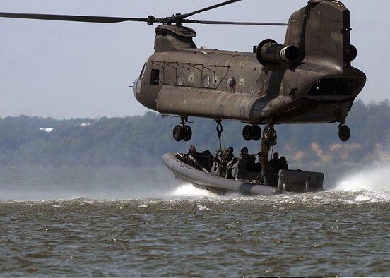 
A CH-47 Chinook in a training exercise with US Navy Special Warfare (in rigid-hulled inflatable boat) and 159th Aviation Regiment personnel, Virginia Capes, Virginia, July 2008.