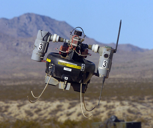 
Naval Air Weapons Station China Lake, California - A Micro Air Vehicle (MAV) flies over a simulated combat area during an operational test flight. The MAV is in the operational test phase with military Explosive Ordnance Disposal (EOD) teams to evaluate its short-range scouting capabilities.