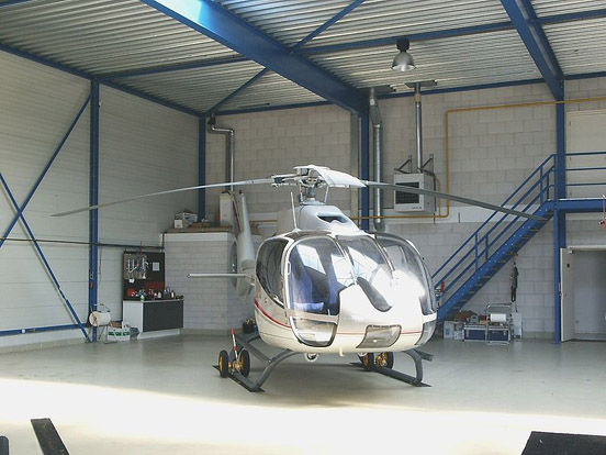 
An Eurocopter EC 130 operated by Heli Holland in a hangar at Lelystad Airport