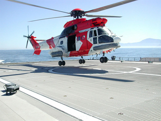
An Atlas Oryx helicopter touches down on a helideck onboard the High Speed Vessel Swift (HSV 2) ship