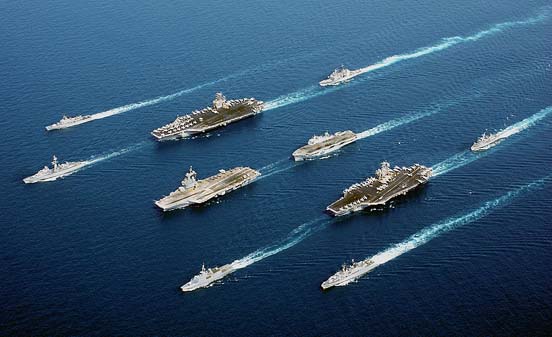 
Four modern aircraft carriers of various types—USS John C. Stennis, FS Charles de Gaulle, HMS Ocean and USS John F. Kennedy—and escort vessels on operations in 2002. The ships are sailing much closer together than they would during combat operations.