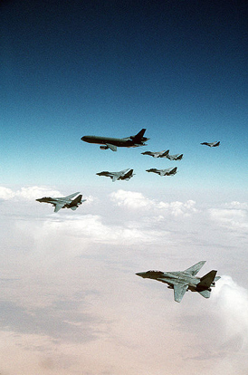 
F-14 Tomcats from the Red Sea and Persian Gulf await their turn refueling from a KC-10A over Iraq during Desert Storm.