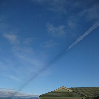 
A shadow cast by vapour trail.