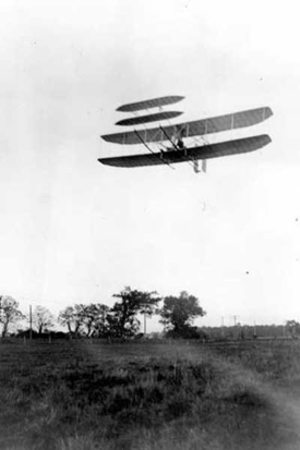 
Wright Flyer III piloted by Orville over Huffman Prairie, October 4, 1905. Flight #46, covering 20 and 3/4 miles in 33 minutes 17 seconds; last photographed flight of the year