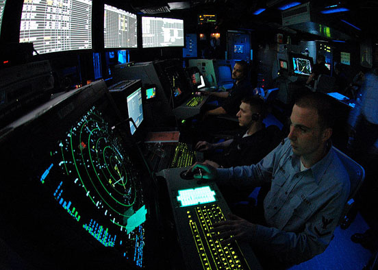 
A military air traffic controller works approach controller in Carrier Air Traffic Control Center (CATTC) aboard the Nimitz class aircraft carrier USS Abraham Lincoln (CVN 72).