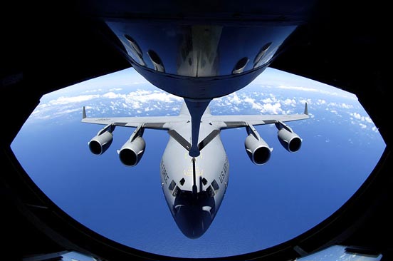 
A C-17 Globemaster refuels through the boom of a KC-135 Stratotanker