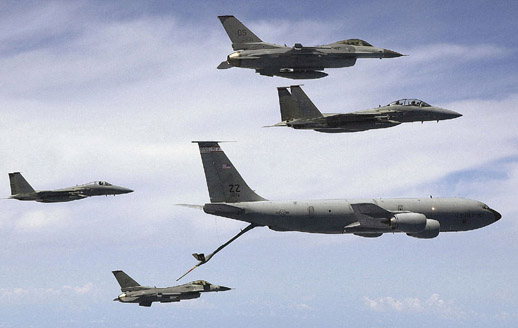 
Boom and receptacle: USAF KC-135R Stratotanker, two F-15s (twin fins) and two F-16s, on an aerial refueling training mission