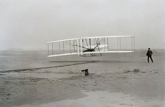 
The Wright Flyer: the first sustained flight with a powered, controlled aircraft.