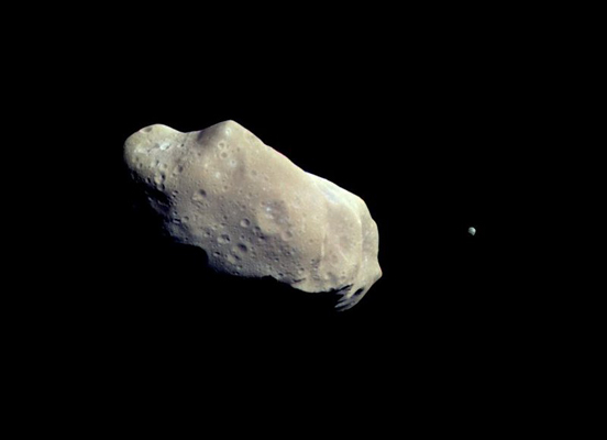 
NASA image of 243 Ida. The tiny dot to the right is its moon, Dactyl.