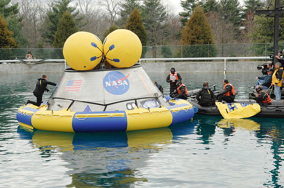 
NASA and Department of Defense personnel familiarize themselves with a Navy-built, 18,000-pound Orion mock-up in a test pool at the Naval Surface Warfare Center's Carderock Division in West Bethesda, Md.