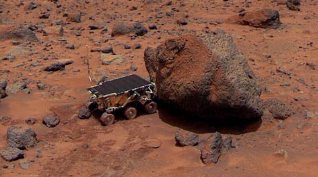 
The Sojourner Rover is taking its Alpha Proton X-ray Spectrometer measurement of the Yogi Rock (NASA)